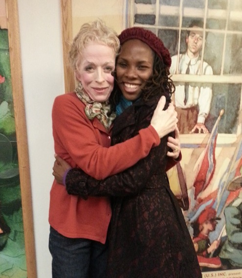 We got photobombed by the painting behind us.Β