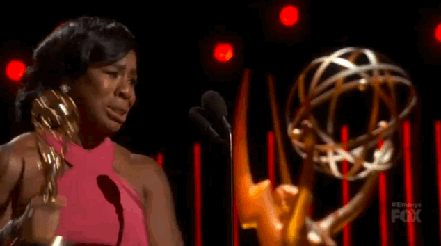 Uzo Aduba on stage getting her 2015 Emmy Award
